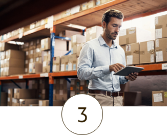 man using ipad in warehouse