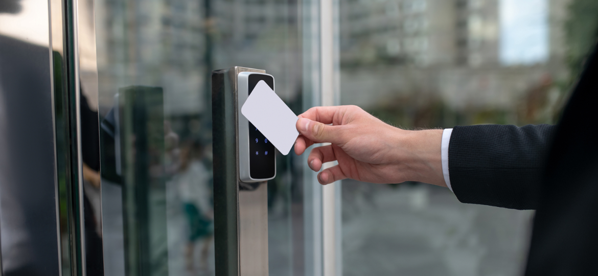 Close up picture of mans hand holding a pass card